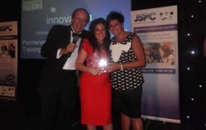 Katy Jobbins Receiving Winner 2012 Innovation in Business Award From TV Presenter Fred Dinage