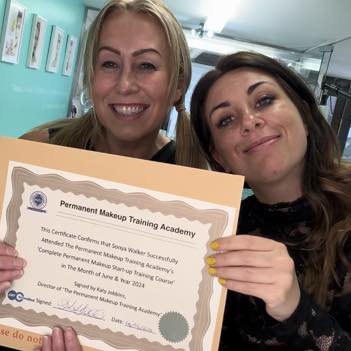 Sonya receiving her permanent makeup training certificate from Katy Jobbins
