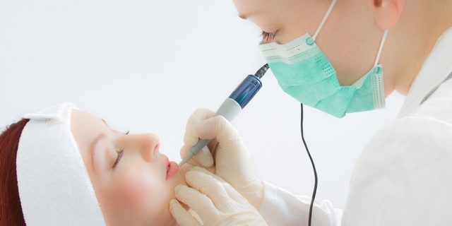 Amy Packer performing permanent makeup on a client