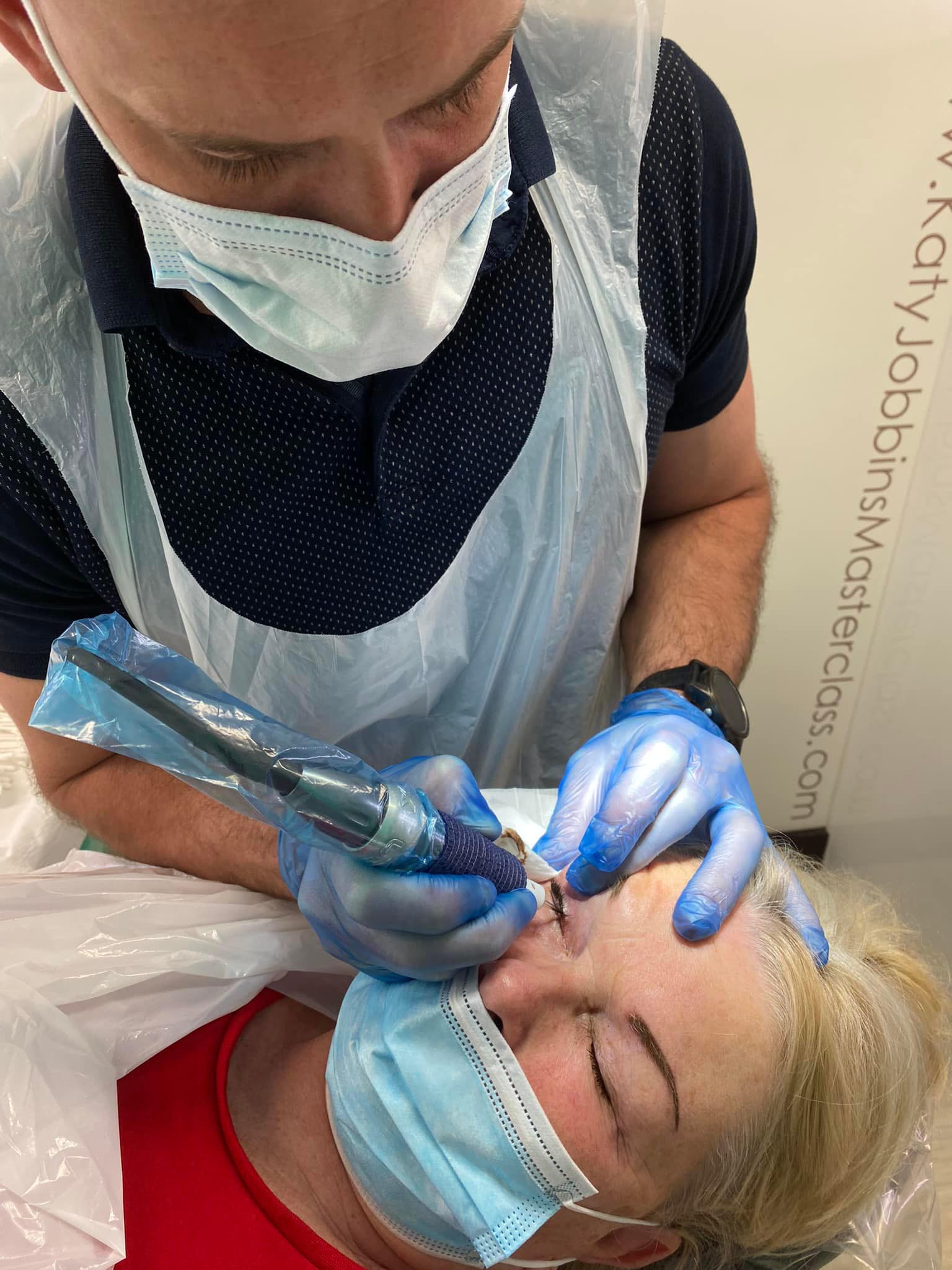 Lee Performing Permanent Makeup on a Client