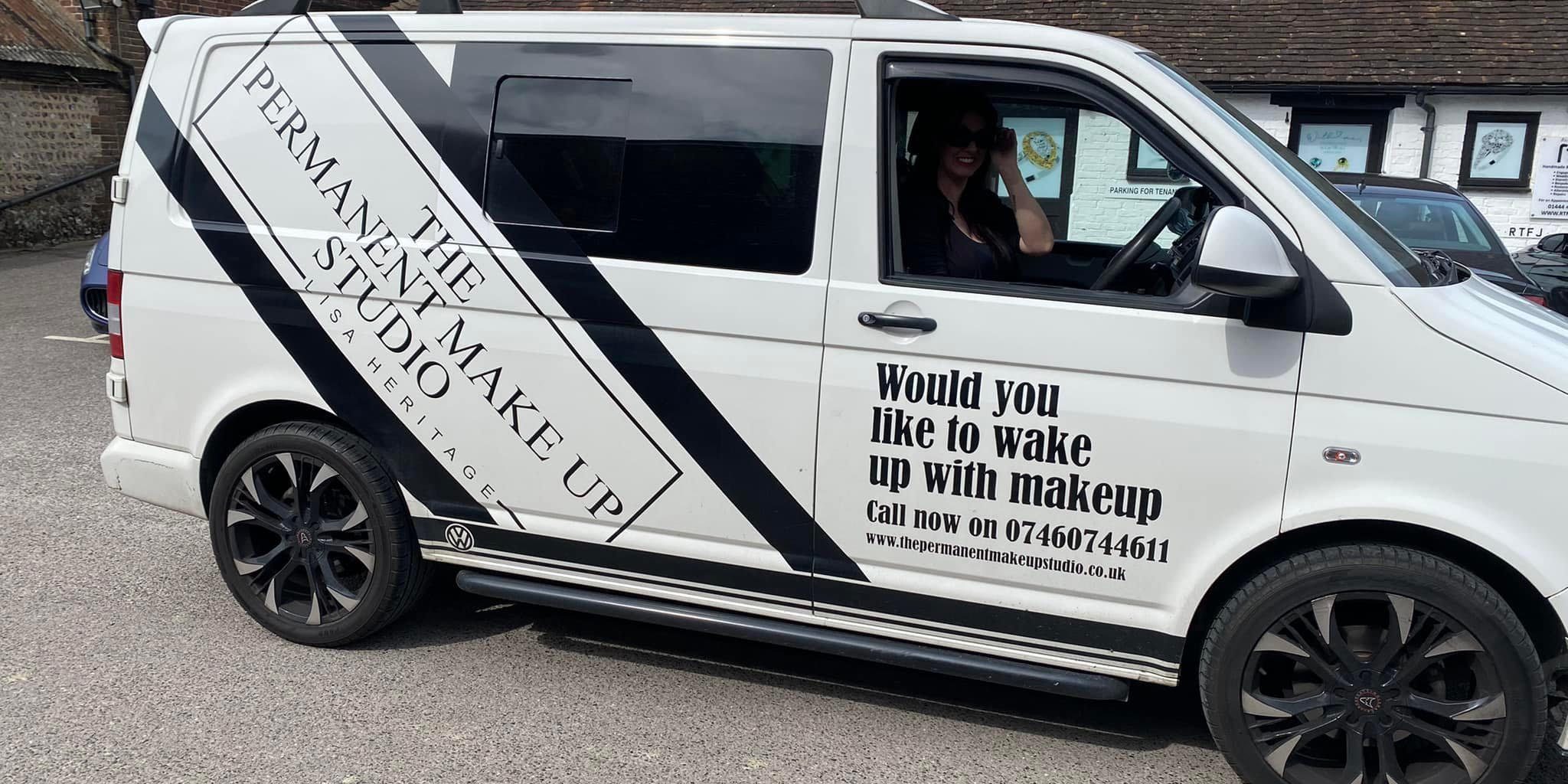 Lisa driving her van advertising her business