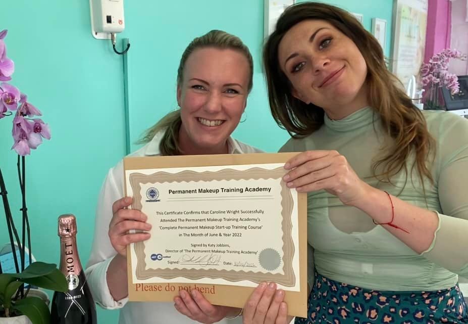 Caroline receiving her training certificate from Katy Jobbins
