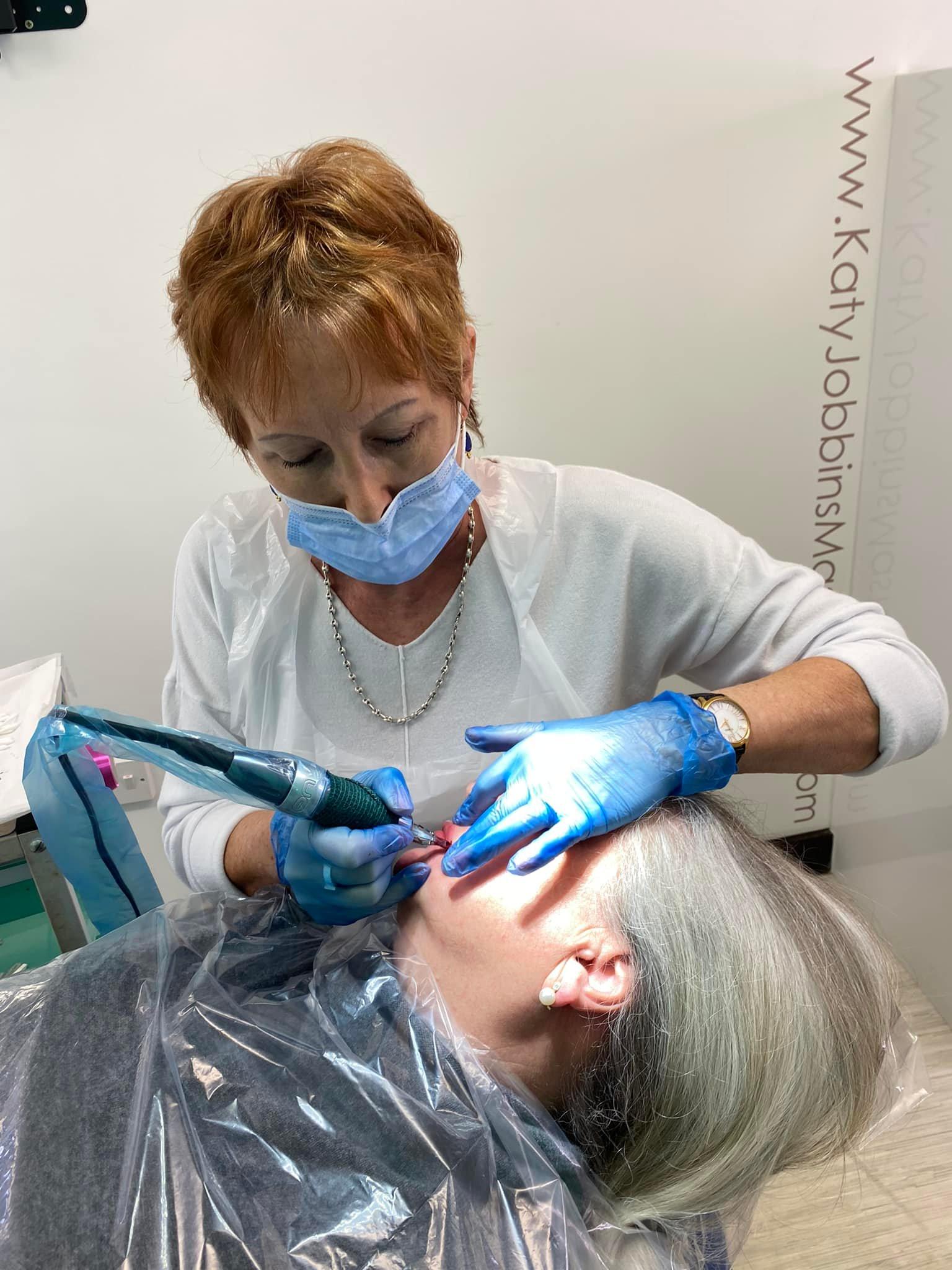 Susan performing permanent makeup on her client