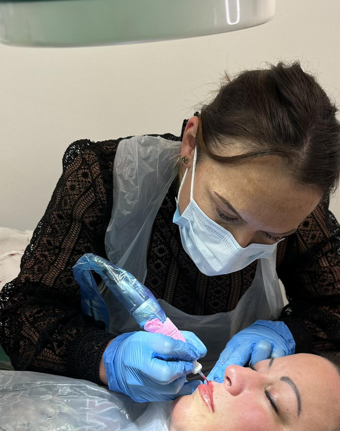 Kate working on a clients lips