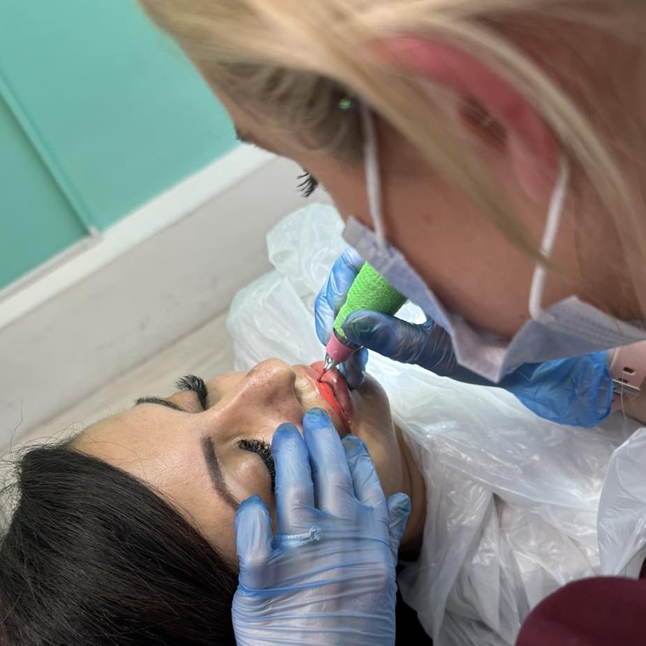 Lucy working on a clients lips