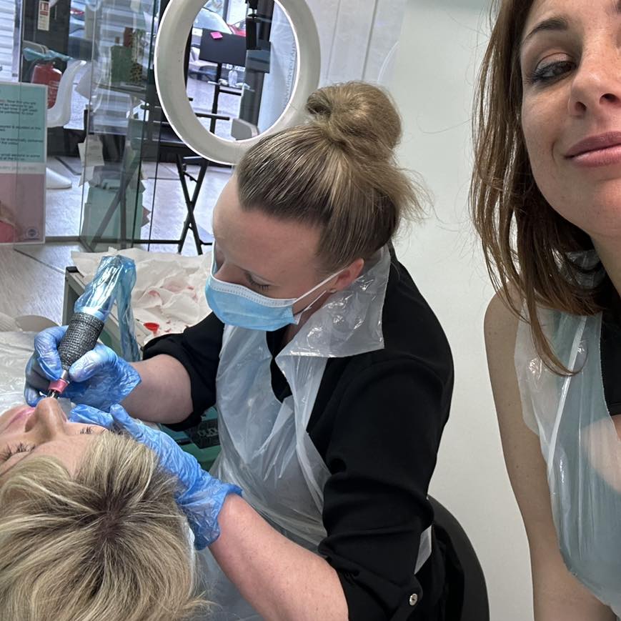 Caroline working on a client's lips