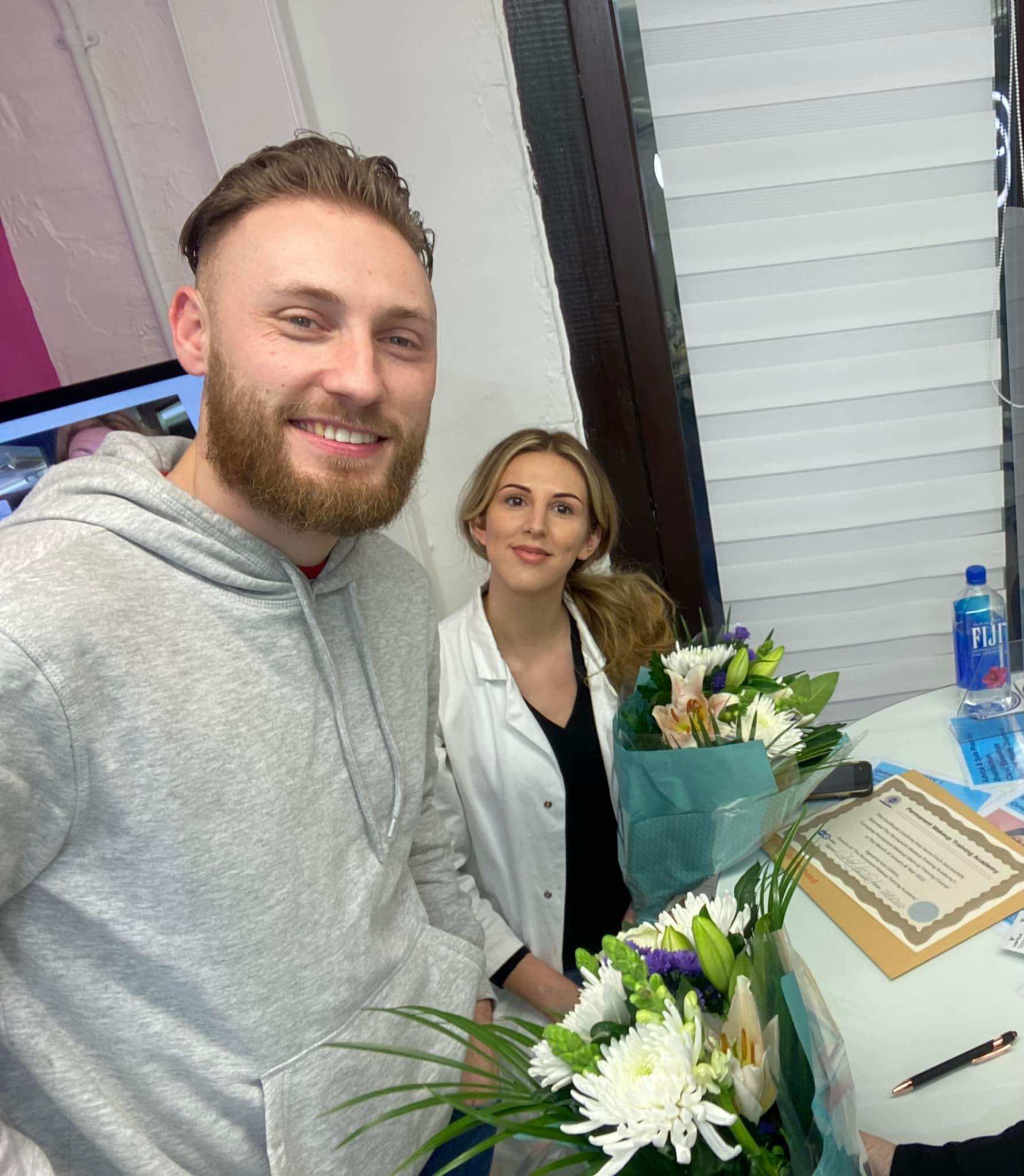 Jenna's husband presents Jenna and Katy with Flowers