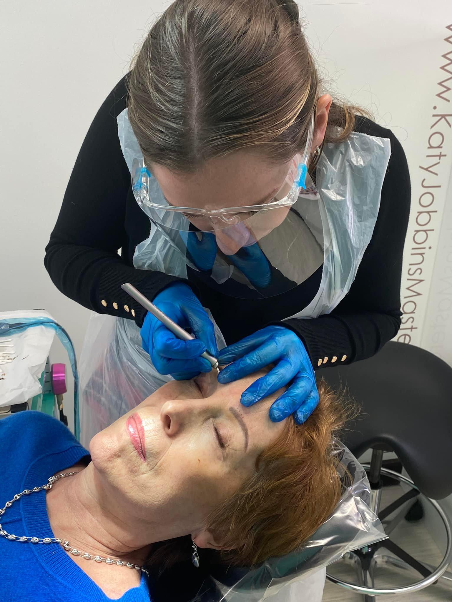 Julia microblading a clients brows