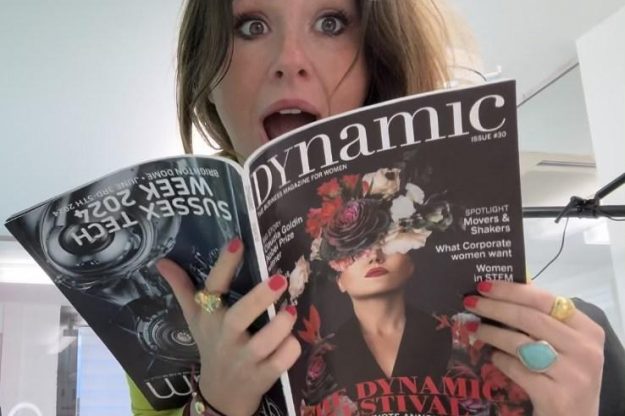 Katy reading an article about herself in Katy in Dynamic Business Magazine for Women