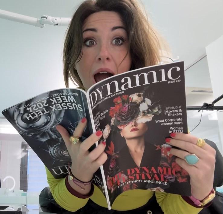 Katy reading an article about herself in Katy in Dynamic Business Magazine for Women