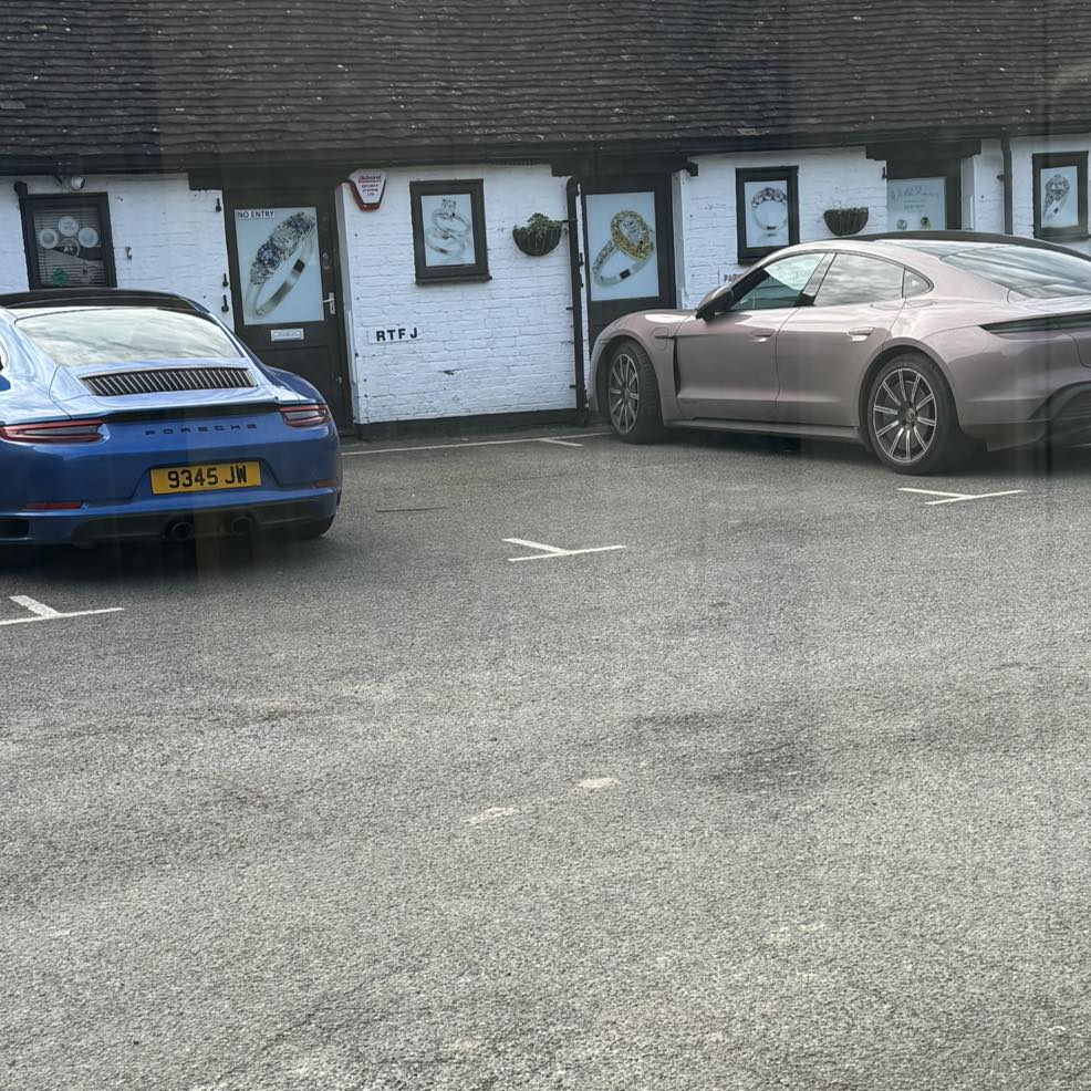 Jules's Blue Porsche next to Katy's Porsche