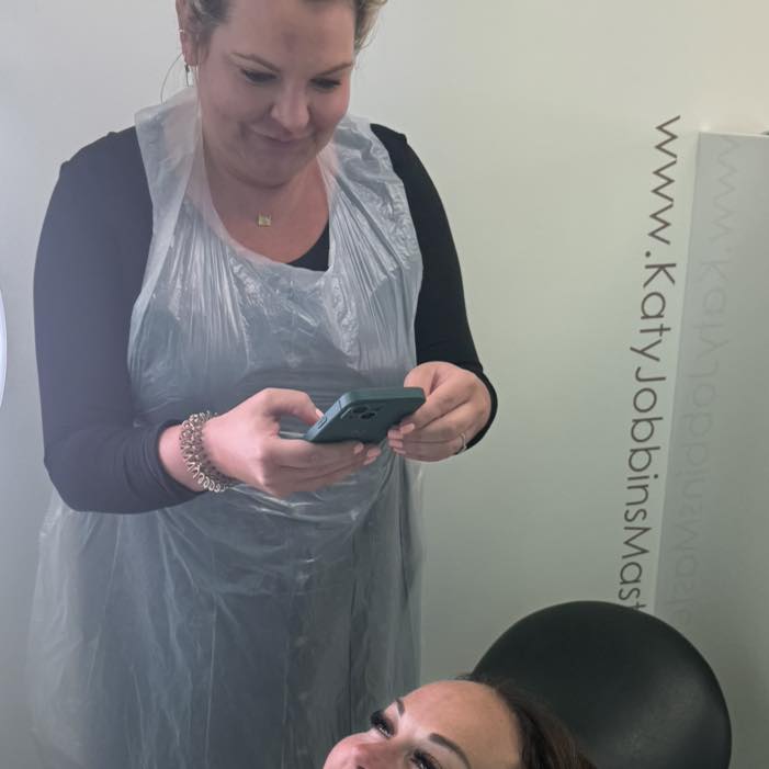 Sarah taking after pictures of her work on a clients permanent eyebrows